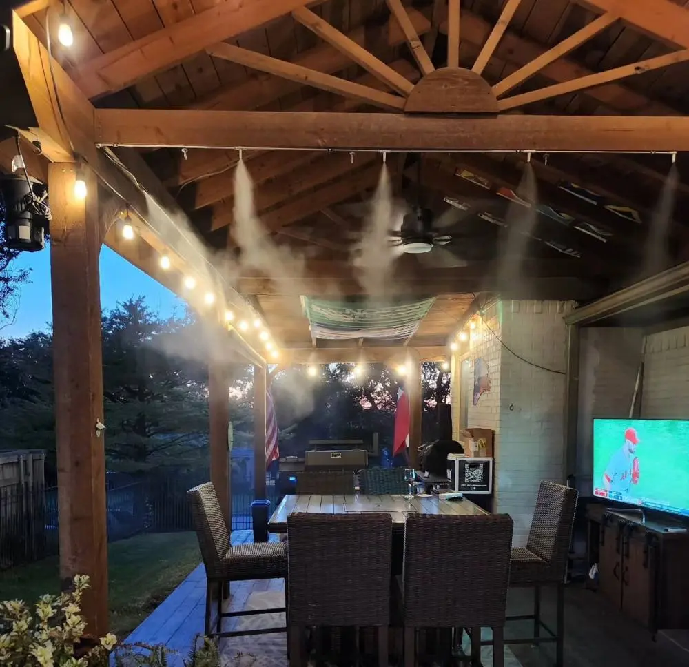 <p>The best place to install a misting line is on an <b>overhead structure like a patio roof or arbor.</b></p>
<p>Install the misting line between <b>8ft and 14ft</b> (ideal is <b>10–12ft</b>). If installing below 9ft, we recommend downsizing nozzle size by one.</p>
<p>Place nozzles <b>2ft apart</b> and angle them to fill the space with mist. Placing nozzles outside, or pointing them away from the space will reduce the cooling effect.</p>
<p>Misting lines can be placed along both open and closed sides, but as a general guideline, use open sides first.</p>
<p>If 4 sides are not sufficient to install the recommended number of nozzles, additional inner lines can be installed providing that each inner line is at least at these distances from the next parallel line:</p>
<ul>
<li>6ft apart for fully open spaces</li>
<li>12ft apart for patios with a roof and 4 open sides</li>
<li>14ft apart for patios with roof and 1+ closed side</li>
</ul>
<p>When hard overhead construction is not available, <b>string cable lights or steel cables </b>can be used to hold the misting lines.</p>
<p>When using string cable lights or steel cables, we recommend using only plastic tubing and zip ties to secure tubing to cables.</p>
<p>If no overhead options are available, you can also <b>attach misting nozzles to outdoor fans</b> for spot cooling.</p>
's 1. image